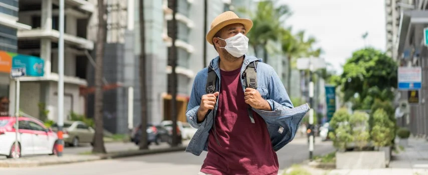 Backpacker in City wearing face mask