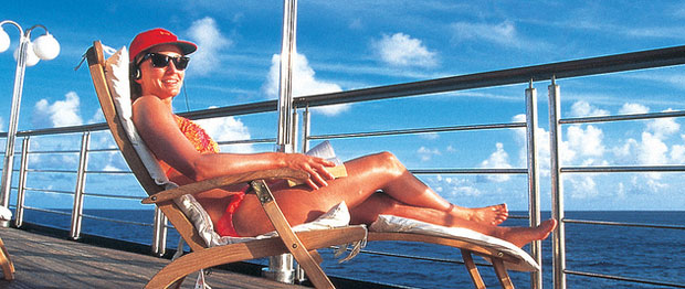 A solo traveller enjoying a the view on a cruise