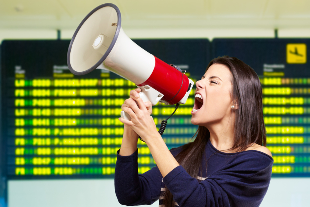 Woman screaming into megaphone