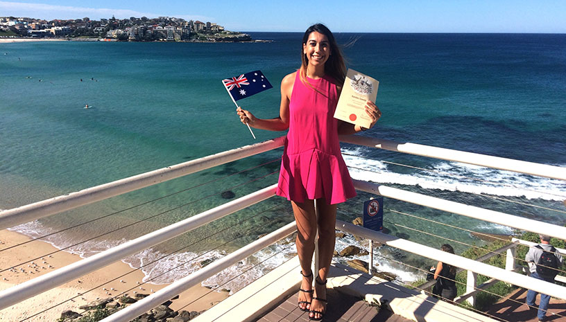 female near beach with citizenship papers